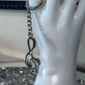 Silver tone music note key chain.